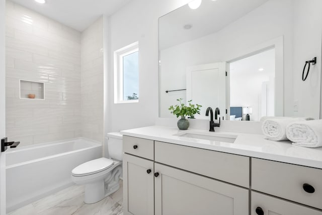 full bathroom featuring vanity, toilet, and tiled shower / bath