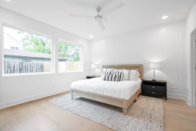 bedroom featuring ceiling fan and light wood-type flooring