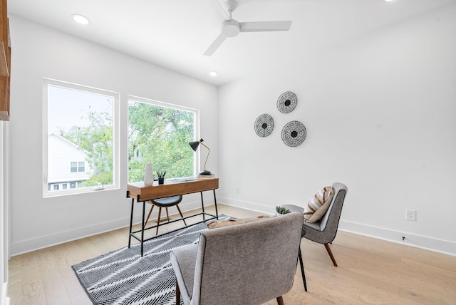 office area with ceiling fan and light hardwood / wood-style flooring