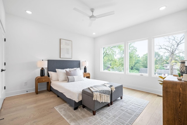 bedroom featuring light wood-type flooring and ceiling fan