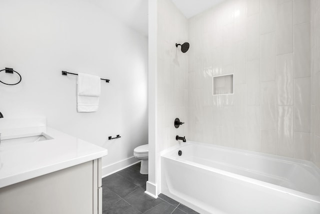 full bathroom featuring tile patterned floors, vanity, toilet, and tiled shower / bath