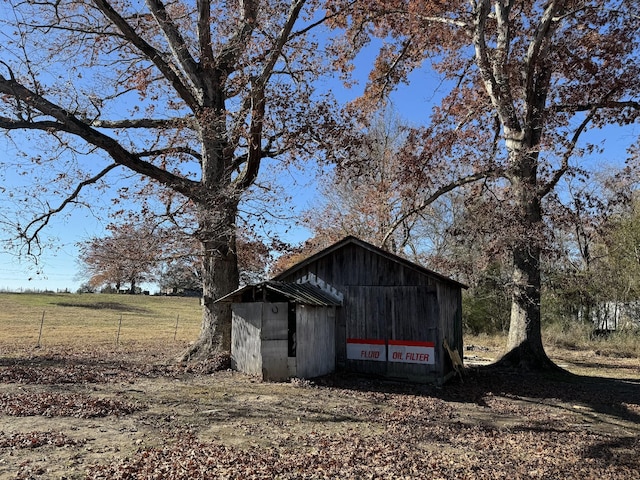 view of outdoor structure featuring a rural view