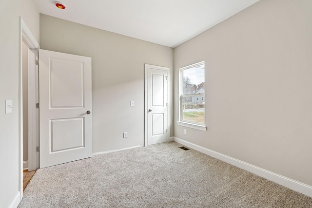 unfurnished bedroom with carpet flooring