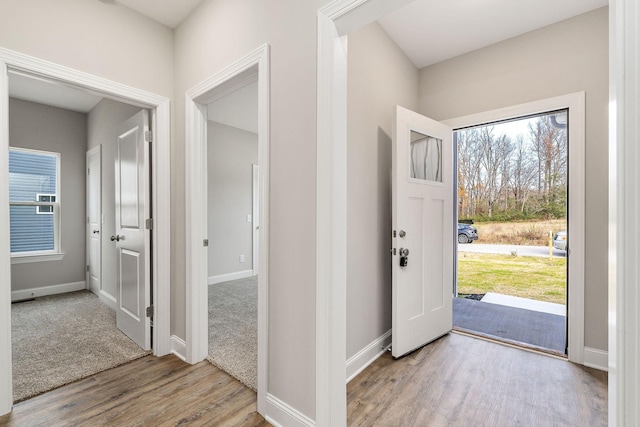 foyer entrance with light hardwood / wood-style flooring