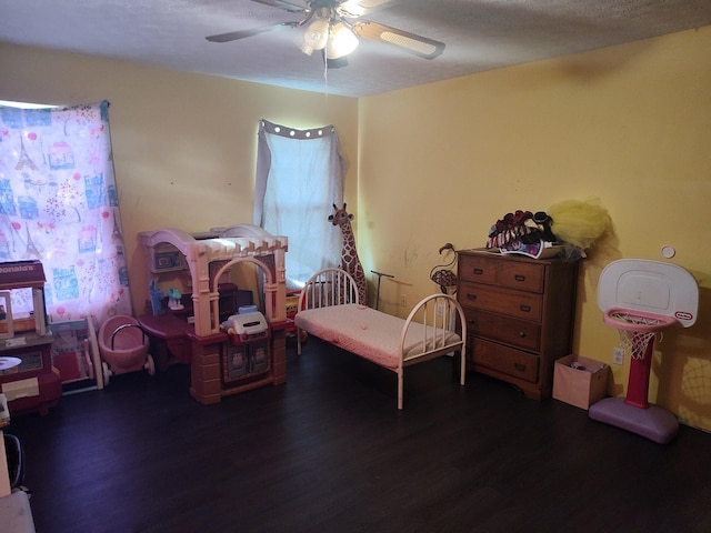 bedroom with ceiling fan and dark wood-type flooring