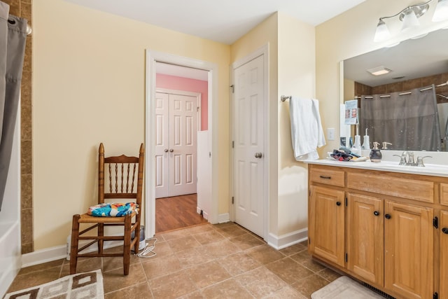 bathroom with vanity and wood-type flooring