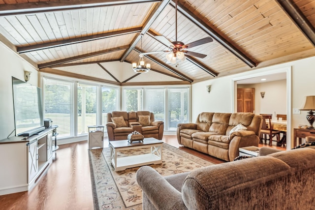 living room with ceiling fan with notable chandelier, vaulted ceiling with beams, hardwood / wood-style flooring, and wood ceiling