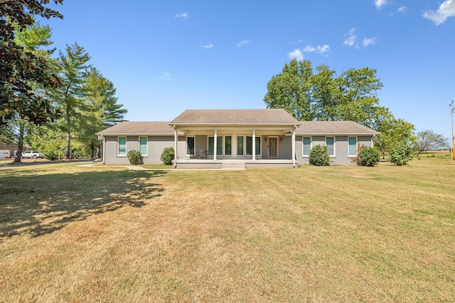 view of front of property with a porch and a front lawn