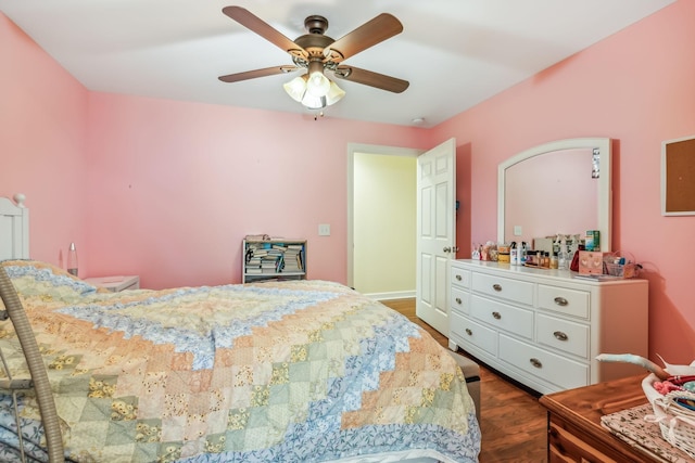 bedroom with ceiling fan and dark hardwood / wood-style floors