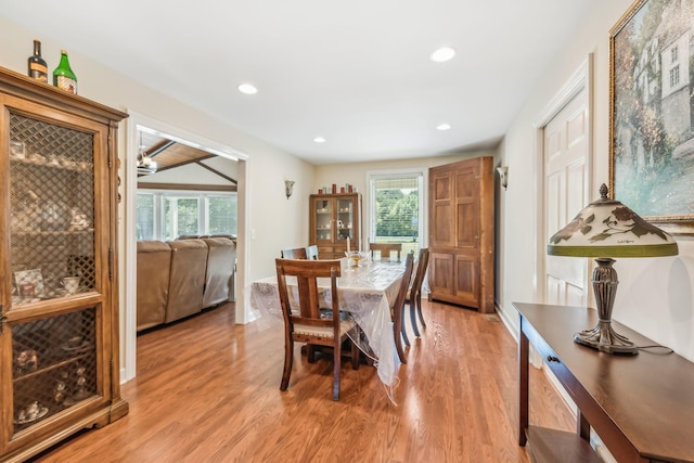 dining room with a chandelier and light hardwood / wood-style flooring