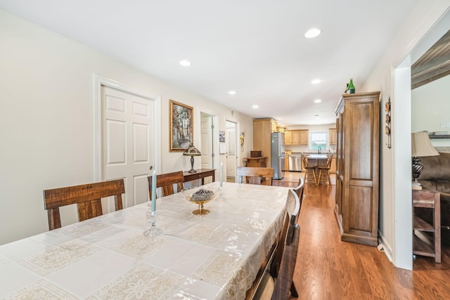 dining area with light hardwood / wood-style floors