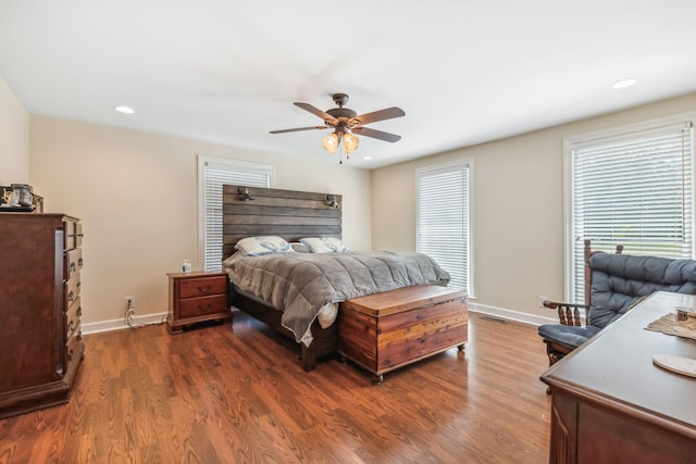 bedroom featuring ceiling fan and dark hardwood / wood-style flooring