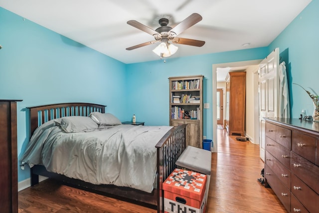 bedroom featuring wood-type flooring and ceiling fan