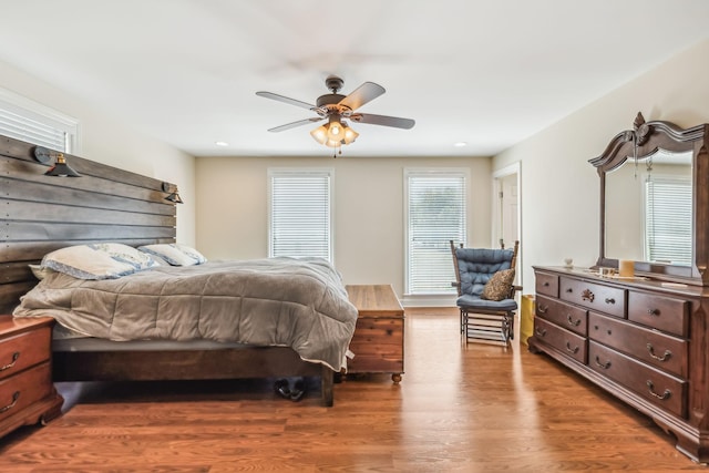 bedroom featuring ceiling fan and dark wood-type flooring