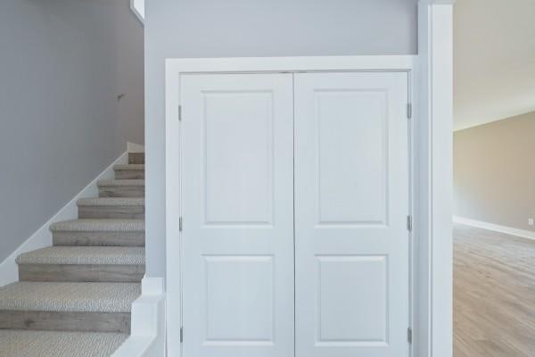 staircase featuring hardwood / wood-style flooring