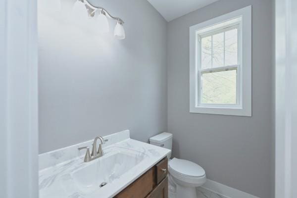 bathroom with vanity and toilet