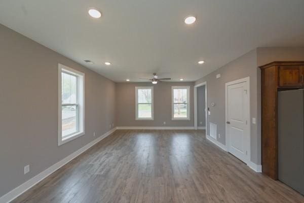 interior space with light hardwood / wood-style flooring and ceiling fan