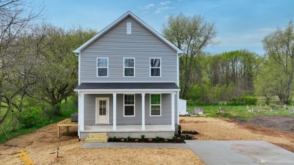 104A N St, Portland, TN 37148 - rear view of property featuring covered porch and a forest view
