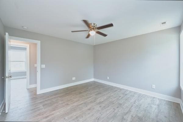 unfurnished room featuring light hardwood / wood-style floors and ceiling fan