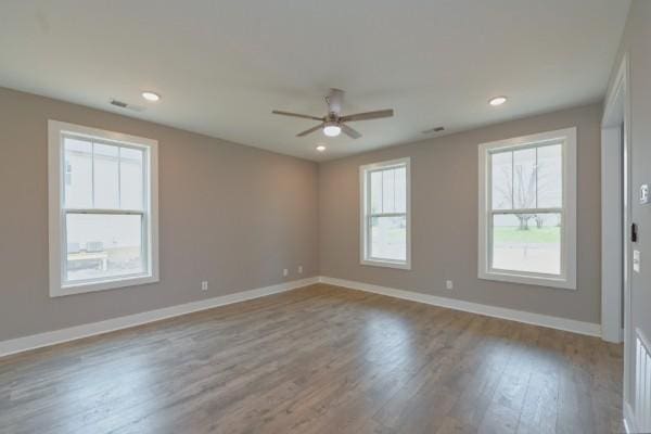 unfurnished room featuring ceiling fan and light wood-type flooring