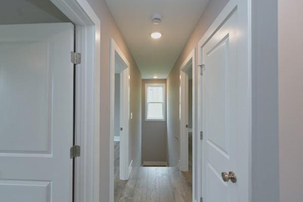 hallway with light wood-type flooring