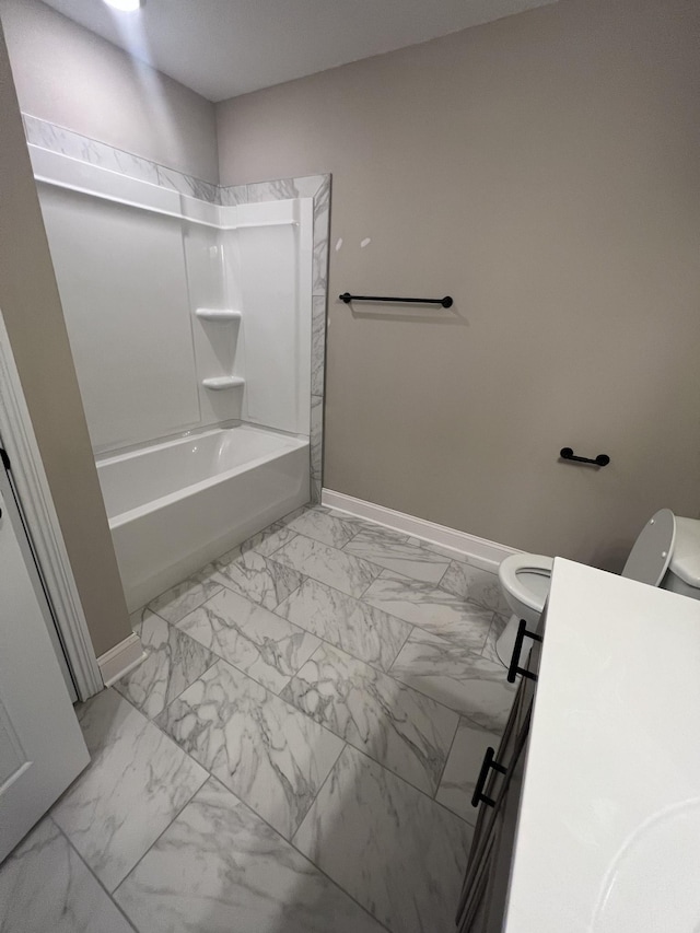 bathroom featuring shower / washtub combination and toilet