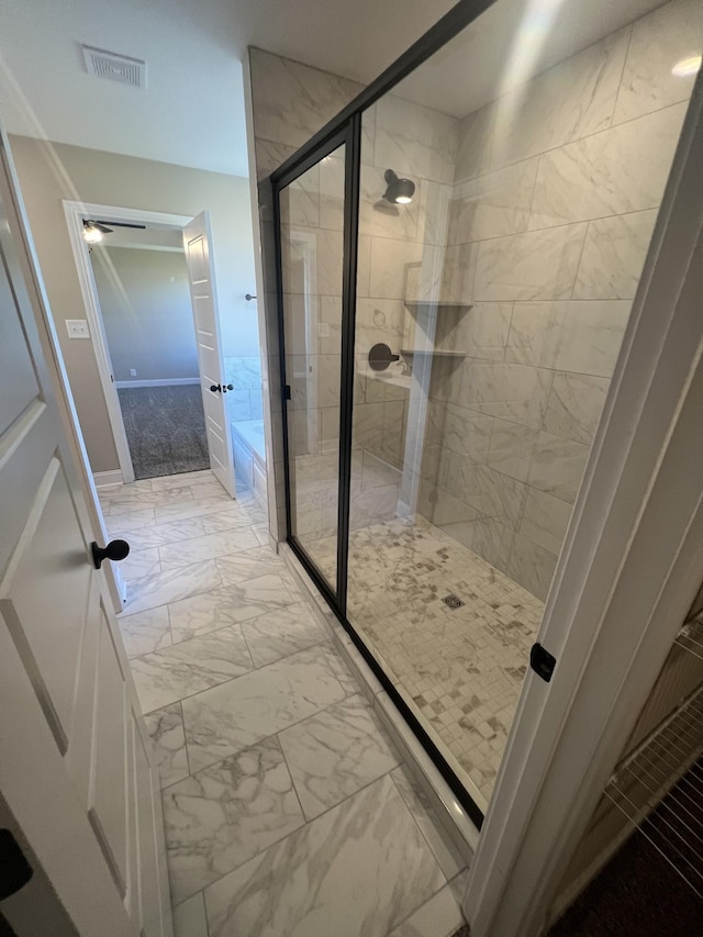 bathroom featuring separate shower and tub