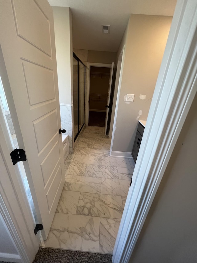 bathroom with vanity and separate shower and tub