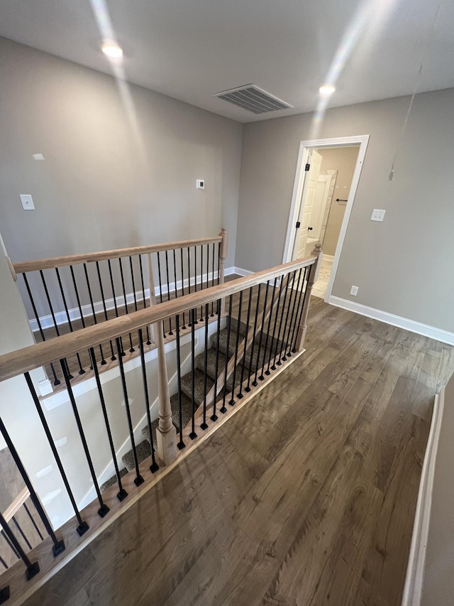 staircase featuring hardwood / wood-style floors