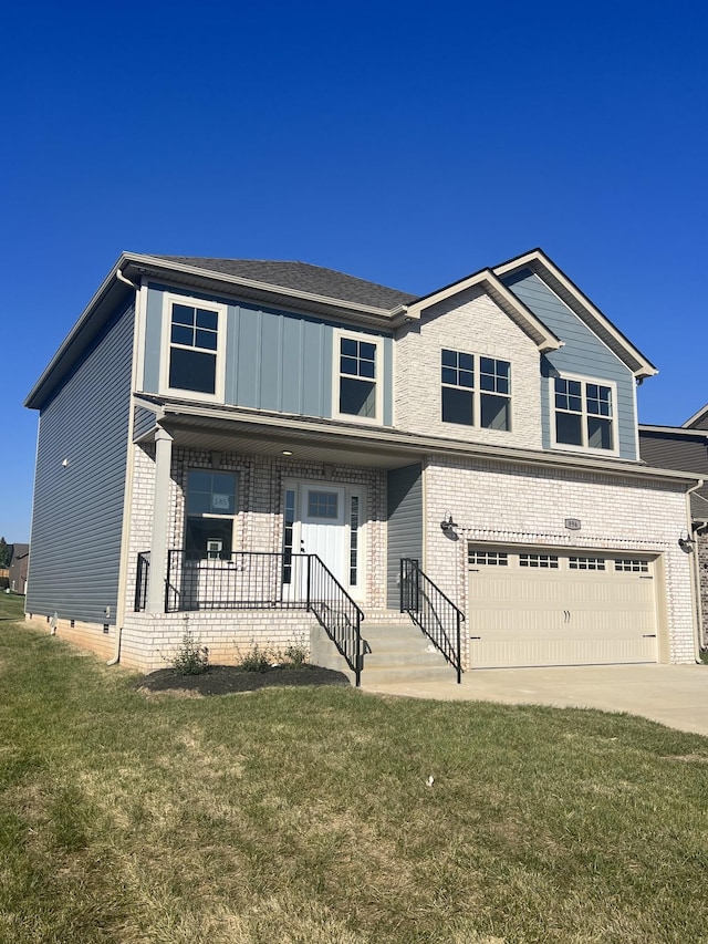 view of front of home with a porch, a garage, and a front lawn