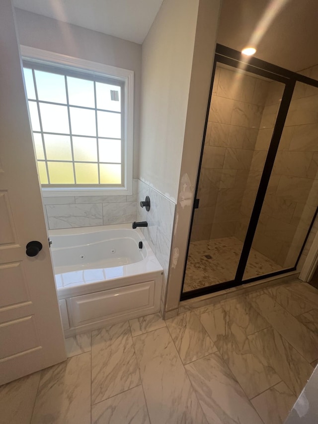 bathroom with shower with separate bathtub