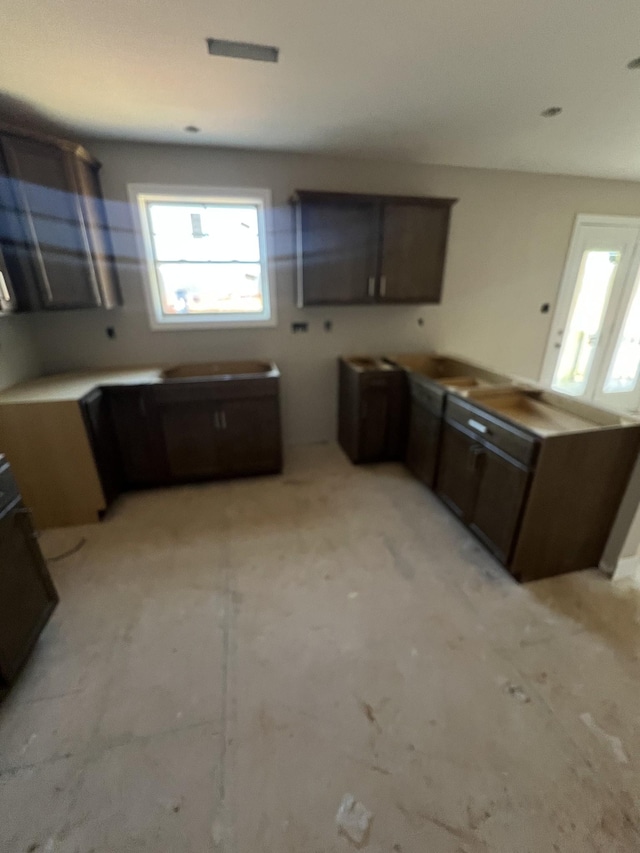 kitchen featuring dark brown cabinetry