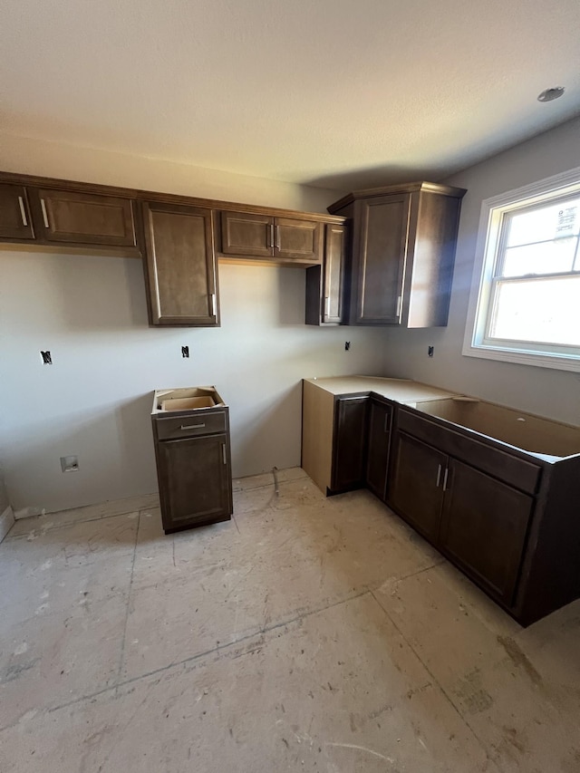 kitchen with dark brown cabinets