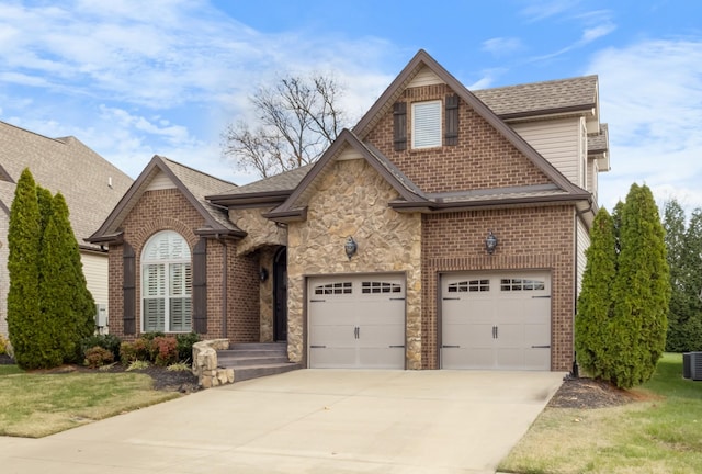 view of front of home featuring a garage and a front lawn