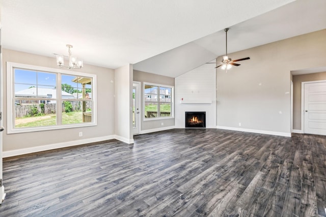 unfurnished living room with baseboards, dark wood-type flooring, a fireplace, and ceiling fan with notable chandelier