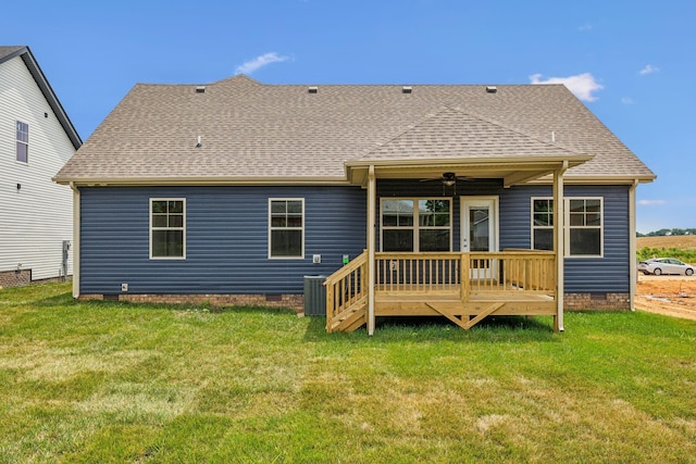 back of house with crawl space, ceiling fan, a yard, and roof with shingles