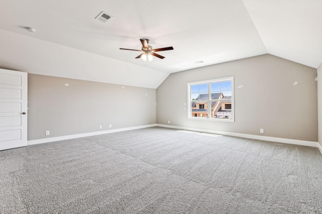 bonus room featuring lofted ceiling, baseboards, visible vents, and carpet floors