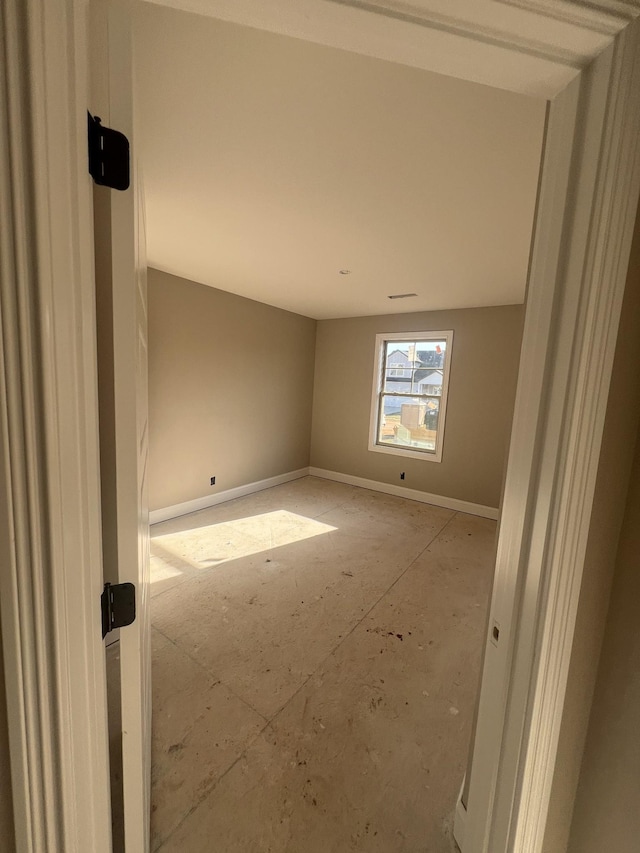 empty room with baseboards