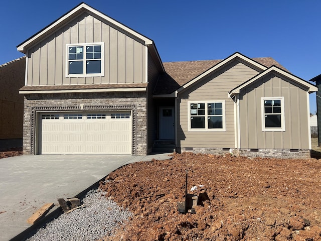 view of front of home with board and batten siding, a shingled roof, a garage, crawl space, and driveway