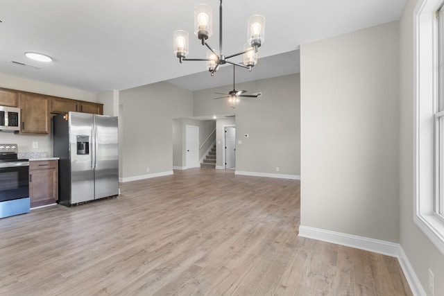 130 Anderson Pl, Clarksville, TN 37042 - kitchen with ceiling fan with notable chandelier, light wood-type flooring, light countertops, appliances with stainless steel finishes, and visible vents