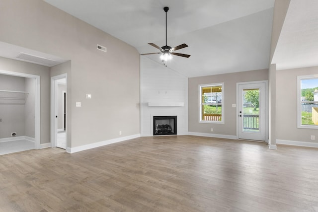 130 Anderson Pl, Clarksville, TN 37042 - unfurnished living room featuring light wood-type flooring, baseboards, visible vents, a ceiling fan, and a large fireplace