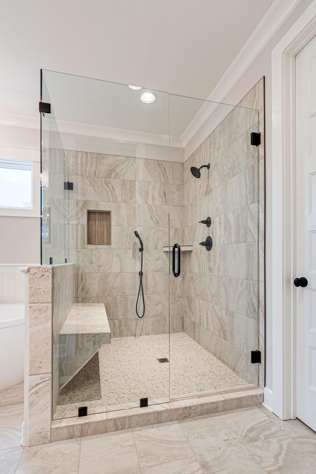 bathroom featuring shower with separate bathtub and crown molding