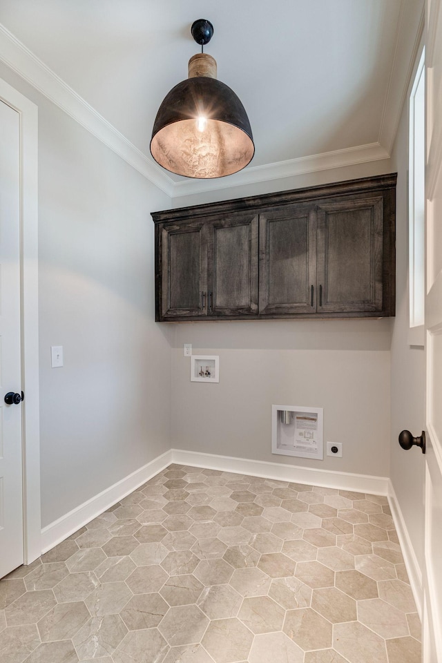 laundry room with electric dryer hookup, cabinets, crown molding, and washer hookup