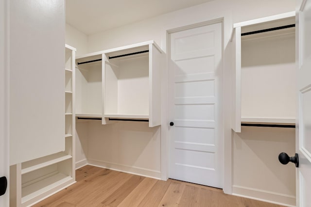 walk in closet featuring light hardwood / wood-style floors