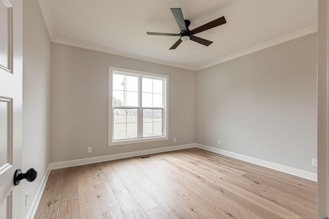 empty room featuring ceiling fan, crown molding, and light hardwood / wood-style flooring