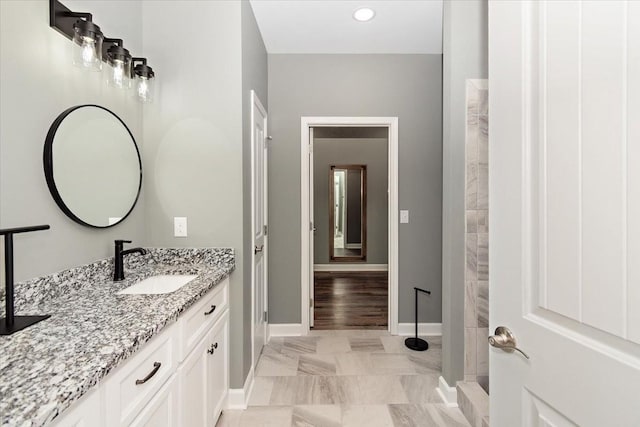 bathroom with vanity and wood-type flooring