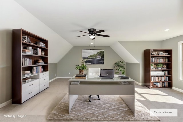 office with ceiling fan, light carpet, and vaulted ceiling