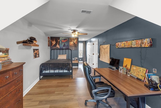 bedroom with ceiling fan and light hardwood / wood-style flooring