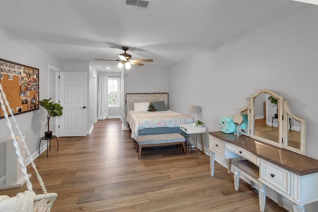 bedroom featuring hardwood / wood-style floors and ceiling fan