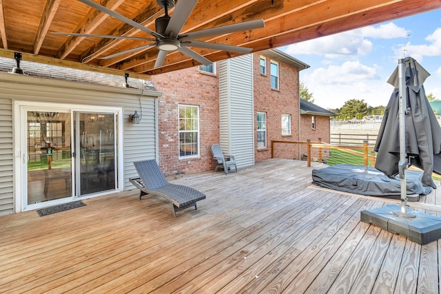 wooden deck featuring ceiling fan